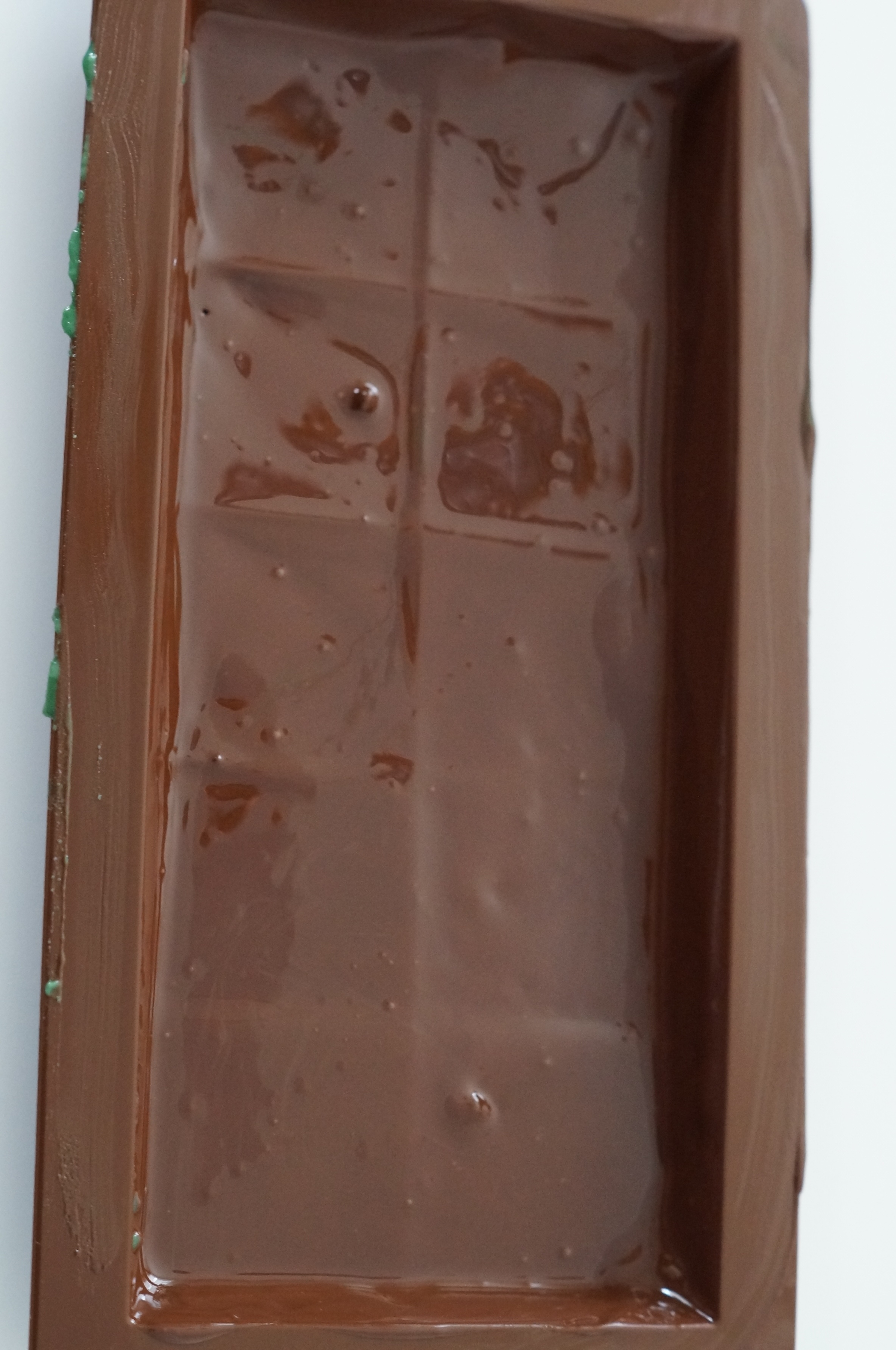 Chocolate shell being prepared in the mold